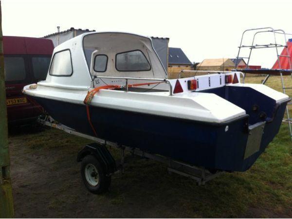 16ft fibreglass boat with cab and trailer