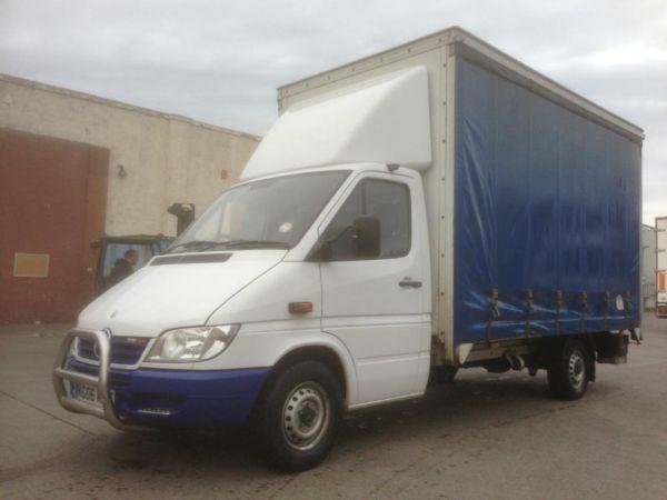 Mercedes 311 sprinter curtainsider with towbar and tailift.