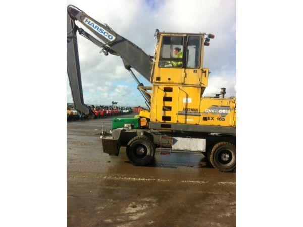 HIGH RISE CAB AKERMAN EW230 SCRAP HANDLER WITH STABILISERS AND PIPED FOR GRAB